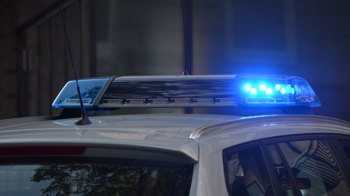 The blue light on top of the cop car