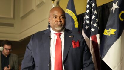 Republican North Carolina gubernatorial candidate Lt. Gov. Mark Robinson walks off the stage after speaking at an election night watch party.