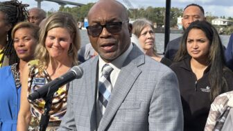 Georgia State Sen. Harold Jones of Augusta speaks at a news conference outdoors.