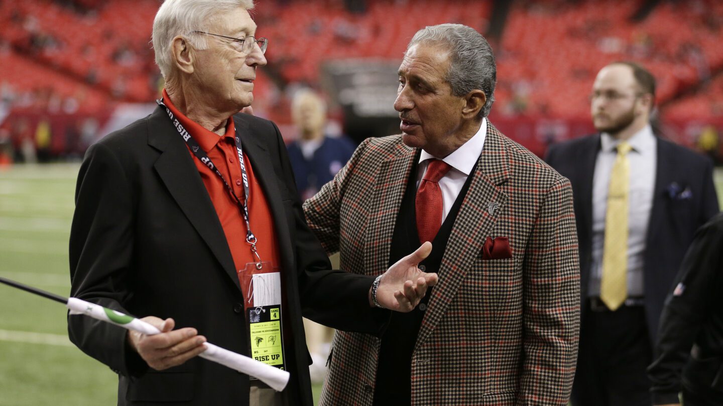 Bernice Marcus stands to the left of Arthur Blank.