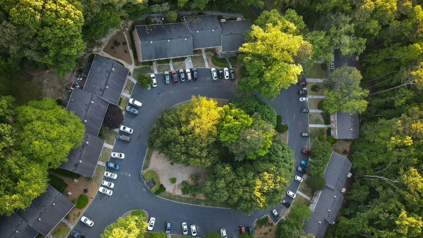 A circular parking lot shot from a bird's eye view.