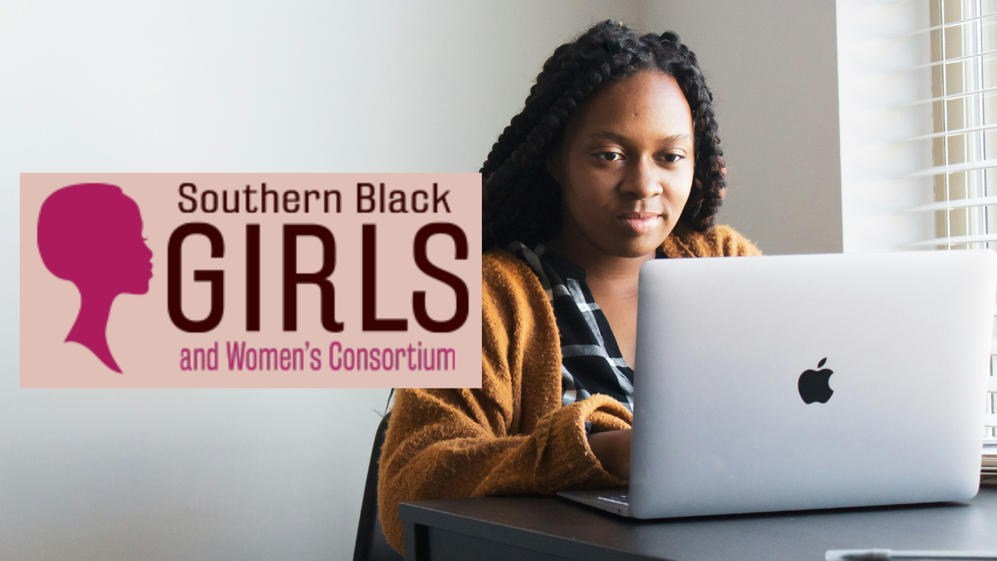 A woman at the computer with the Southern Black Girls logo in front of the photo.