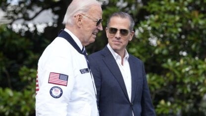 Joe Biden and Hunter Biden walk side by side.