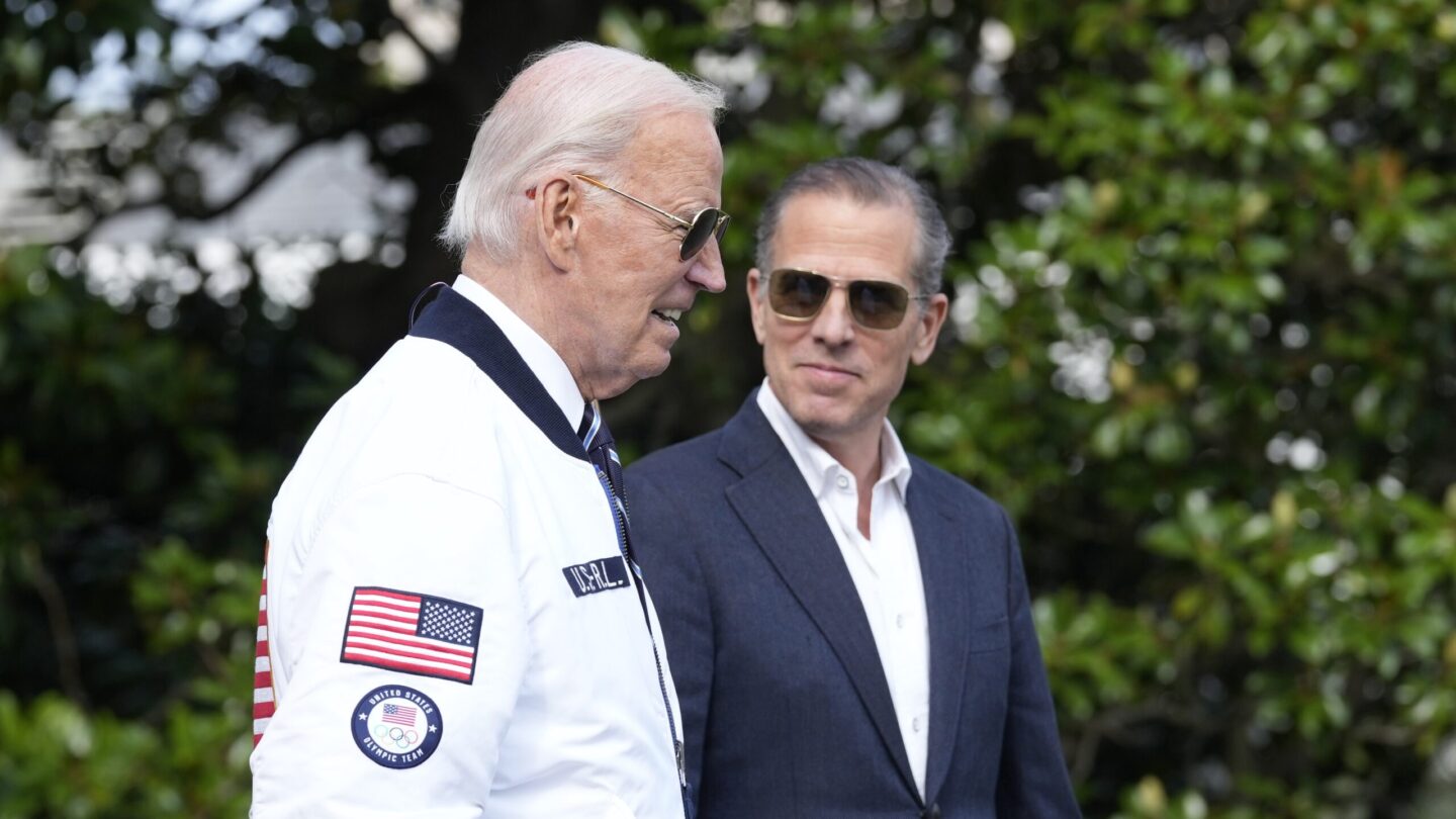 Joe Biden and Hunter Biden walk side by side.