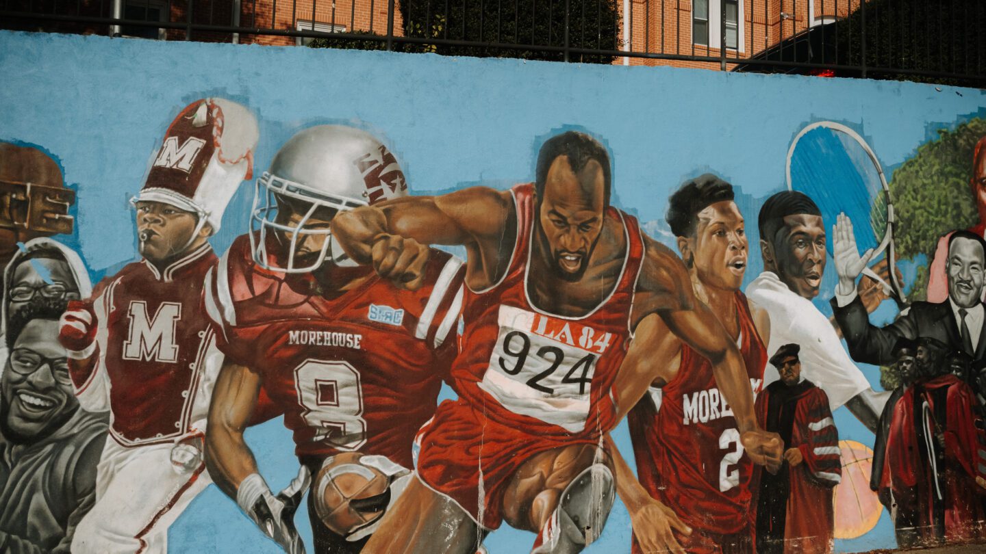 A mural depicting athletes and others on Morehouse College's campus.