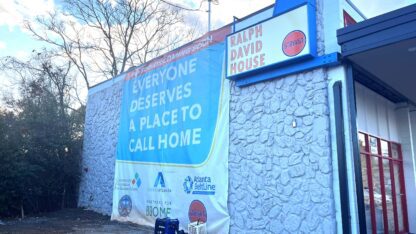 The new Ralph David House in East Atlanta with a large ad hanging off the side of the building that says Everyone Deserves a Place to Call Home.