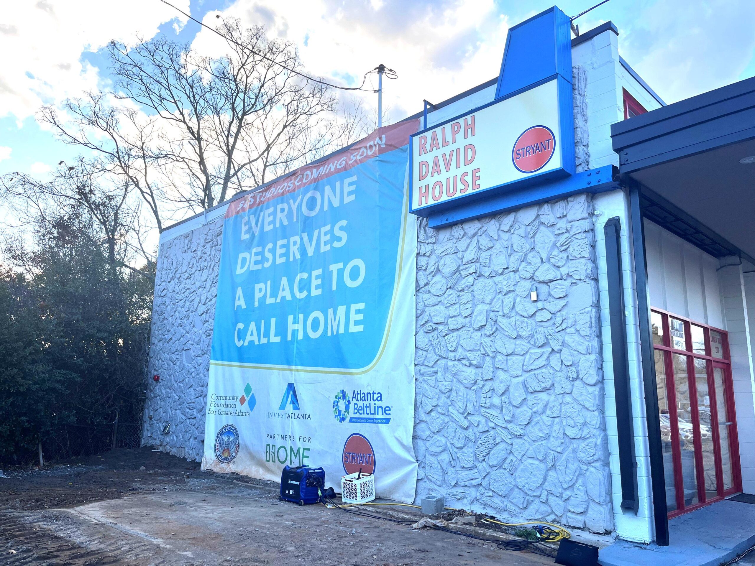 The new Ralph David House in East Atlanta with a large ad hanging off the side of the building that says Everyone Deserves a Place to Call Home.