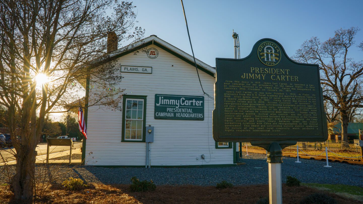 The sun begins to set behind the presidential campaign headquaters of former President Jimmy Carter in his hometown of Plains, Ga.